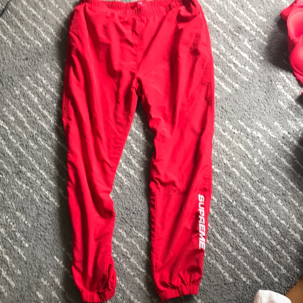 red supreme pants